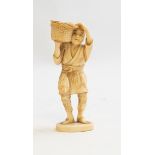 A Japanese ivory okimono of a fisherman carrying a basket of fish, Meiji period, 1868-1912, signed,