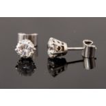 A pair of diamond solitaire platinum stud earrings, two round brilliant cut diamonds,