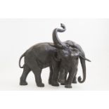 A Japanese bronze study of an elephant and calf with trunk raised, Meiji period, 1868-1912,