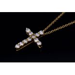 Tiffany & Co - An 18ct gold and diamond cruciform pendant,