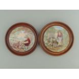 Two Staffordshire Prattware polychrome pot lids, mounted in light wooden frames,