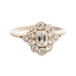 A diamond oval cluster 18ct white gold ring, centre emerald cut diamond approx 0.