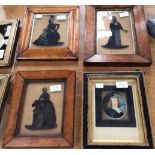 Three 19th Century reverse painted silhouette portraits on glass, ladies in costume,