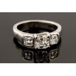 A diamond three stone platinum ring, set with three Asscher cut diamonds,