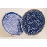 A pair of mid 18th Century Delft blue and white chargers, circa 1755,