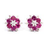 A pair of flower head ruby and diamond cluster earrings, each set with six, 2.