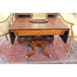 An early 19th Century rosewood pedestal sofa table, fitted with a single frieze drawer, 71cm high,