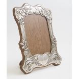 A silver Art Nouveau photograph frame made by Henry Matthew with hallmarks for Birmingham 1902 with