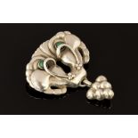 Georg Jensen - a silver brooch set with two malachite cabachon stones in stylised flowers,