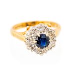 A sapphire and diamond flower head cluster 18ct yellow gold ring,