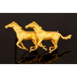 A 9ct yellow gold pair of galloping horses brooch, pair of realistically modelled horses, 55mm long,