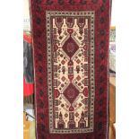 Afghan, hand knotted rug, deep red ground and cream,