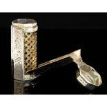 A Continental silver octagonal nutmeg grater, each section engraved with scrolling decoration,