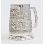 An Asian silver tankard, the body chased with an elephant clearing foliage,