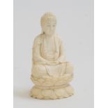 An Oriental ivory model of a buddha, late 19th/early 20th Century,