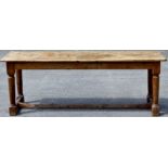 A 18th Century and later joined pine long table, probably made for a Tavern, the top possibly later,