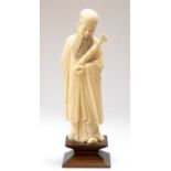 A 19th Century Chinese ivory tusk carving of a bearded elder,