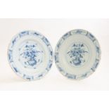 A pair of tin glaze plates, pale blue floral design,