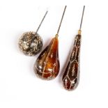 A collection of tortoiseshell hat pins, including pique work,