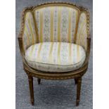 A 19th Century Louis XVI style gilt framed bergere chair, striped upholstery, circular seat,