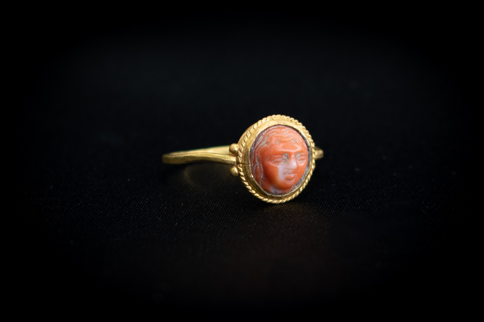 Roman (2nd-2rd century AD) Gold ring with plain band; oval bezel with granule decoration o the edge,