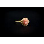 Roman (2nd-2rd century AD) Gold ring with plain band; oval bezel with granule decoration o the edge,