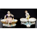 A Berlin porcelain double salt cellar, modelled with a central putto between two floral painted,