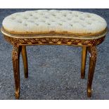 A 19th Century Louis XVI style kidney shaped giltwood deep button backed stool, carved seat rails,