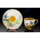A Royal Worcester cabinet cup and saucer, E.