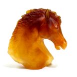 Daum, a pate de verre glass figure of a horses head, orange glass,