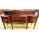 A Regency mahogany breakfront sideboard, circa 1810, raised back,on ring turned tapered legs,