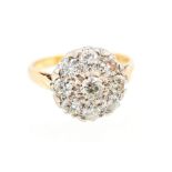 A diamond flower head cluster 18ct yellow gold ring, nine round brilliant cut diamonds,