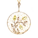 An Edwardian peridot, diamond and seed pearl pendant, circular in form,