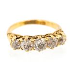 A diamond five stone 18ct yellow gold ring, five round graduating old cut diamonds,