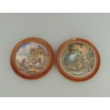 Two Staffordshire Prattware polychrome pot lids mounted in light wooden frames,