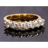 A diamond seven-stone 18ct yellow gold ring, total diamond weight approx 1.