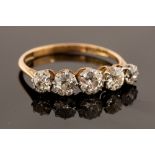 A diamond five stone 18ct yellow gold ring, fine round old cut diamonds,