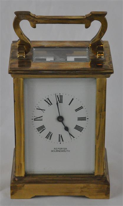 An R E Porter (Bournemouth) brass carriage clock, early 20th century, having white enamel Roman