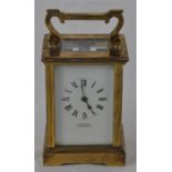 An R E Porter (Bournemouth) brass carriage clock, early 20th century, having white enamel Roman