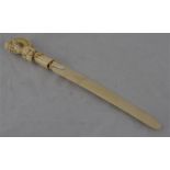 A European carved ivory paper knife, 19th century. Condition: Piece missing from hairpiece to back