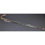 A sword stick, late 19th century, the black painted steel stick with bentwood handle, steel blade