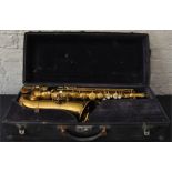A vintage gilt/brass saxophone, bell engraved "Made by C G Conn Ltd 1914" and stamped "Sole