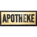 A German 'APOTHEKE' rectangular advertising sign, on a gilt ground within a japanned frame, 26cm x