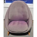 A 20th century design chair, upholstered in purple fabric.