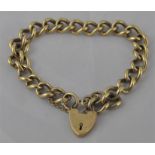 A 9ct. gold curb link bracelet, with padlock clasp, the chain stamped ".375", clasp hallmarked for 9