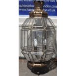 A large Persian style gilt metal mounted octagonal ceiling lantern, with raised panels fitted for