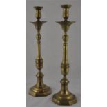 A pair of brass church candle sticks,  height 53.5cm. (2)