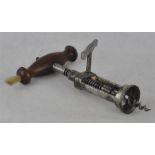 A Victorian wine bottle corkscrew, with wooden handle and original hair brush, 19cm closed.