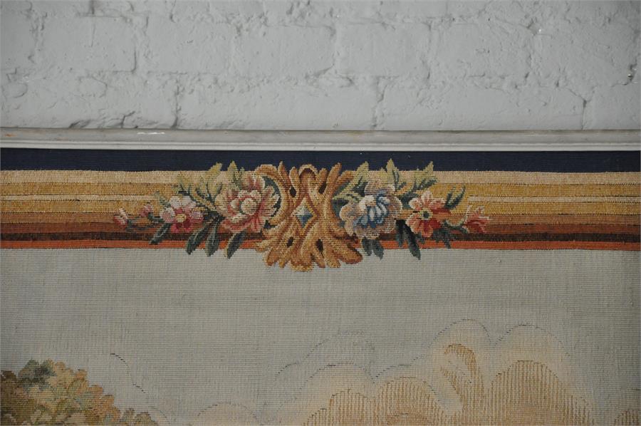 A large Aubusson tapestry, French 20th century, depicting a couple and musician within a forested - Image 3 of 5