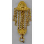 A Continental 19th century yellow metal chatelaine, the hinged clip surmount pierced and cast with